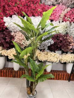 کلوزآپ از برگ‌های لمسی و باکیفیت درختچه باباآدم مصنوعی با ترکیب رنگ سبز تیره و روشن و نمایش رگبرگ‌های طبیعی.